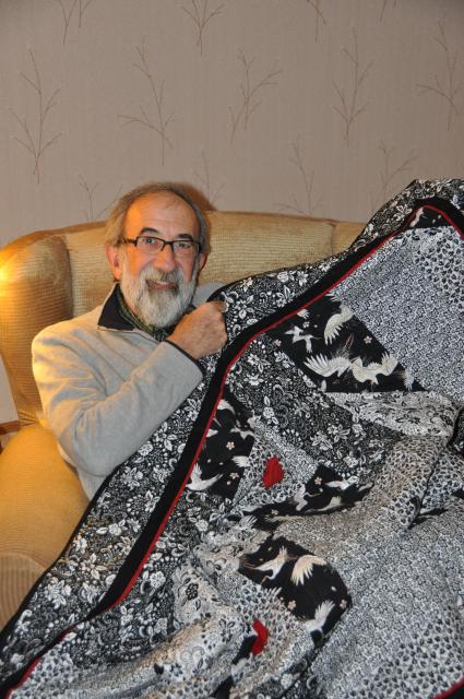 A shot of Larry accepting the gift of the quilt.