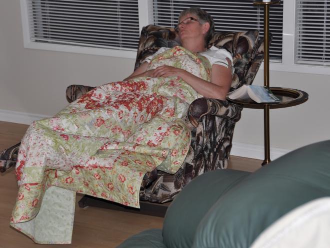 Kristina wrapped upped in her new lap quilt - Spring Fling.