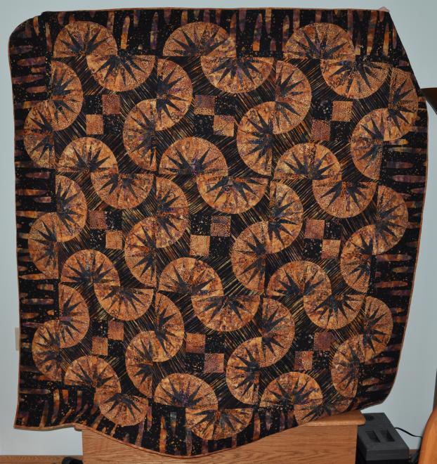 Another full view of the quilt, that is Barbara hidden behind holding it up for all to see.